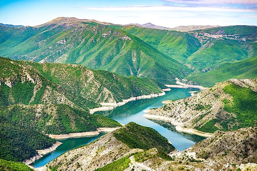 Beautiful blue green Kozjak lake surrounded by hills in the mountains of North Macedonia