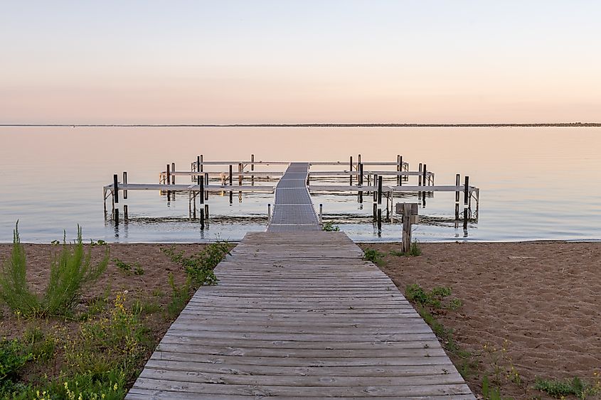 Dock at sunset on Otter Tail Lake in rural Minnesota.