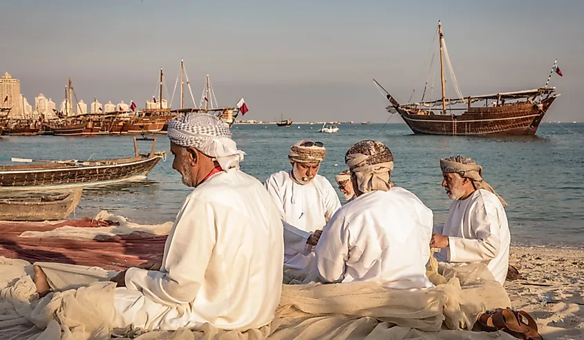 Men making fishing nets for the Dhow festival in Doha, Qatar.