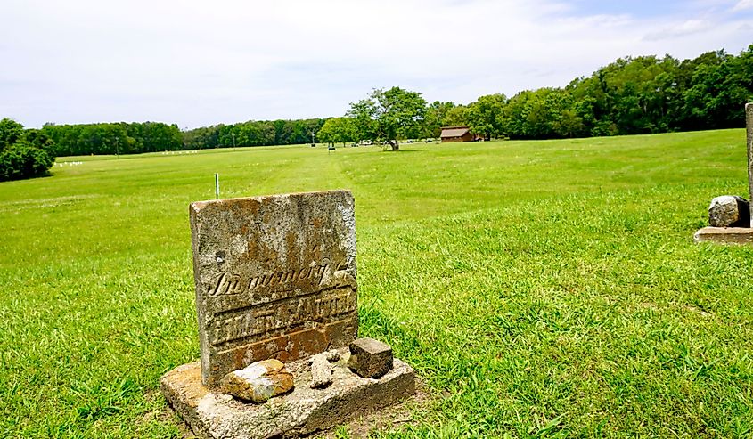 Poverty Point World Heritage Site prehistoric monumental earthworks site constructed by Poverty Point culture. Mound D with grave stone of settler Amanda Malvina from 1800s.