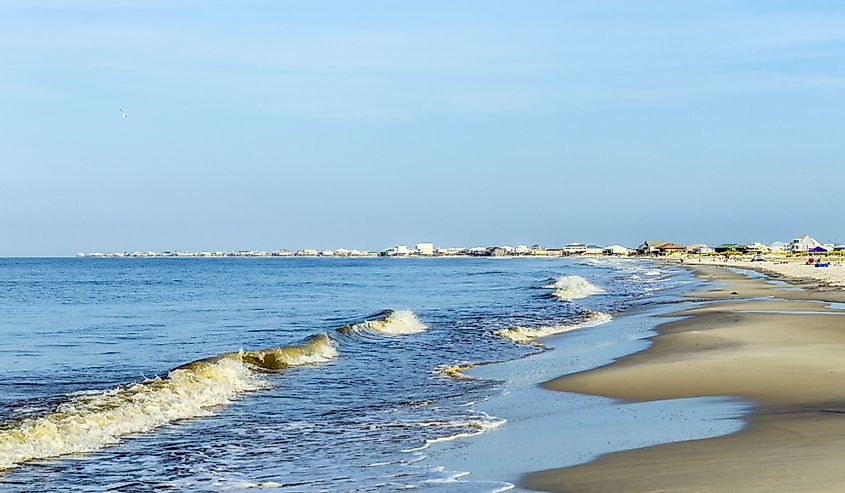 People enjoy the beautiful beach in early morning at Dauphin Island