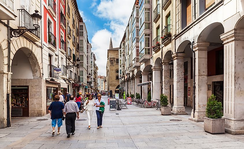  People walking on the street in city center in Burgos, Spain.