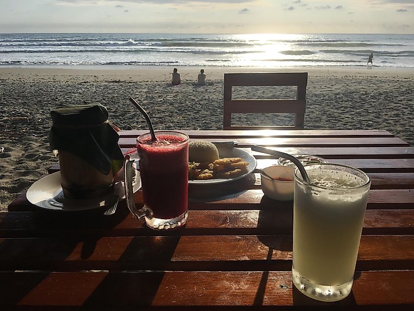 A healthy beachside meal with a freshly made juice