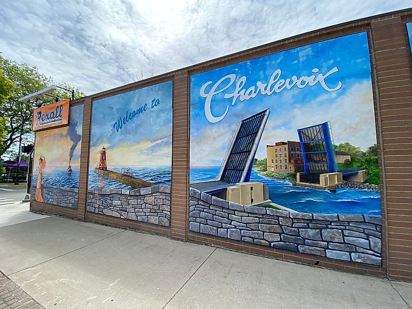 A town mural for Charlevoix, MI, showing its drawbridge, lighthouse pier, and historic steamer.