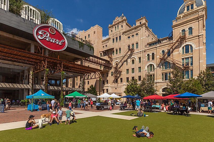 People are walking and shopping at the Farmers Market at Pearl Brewery, San Antonio, Texas