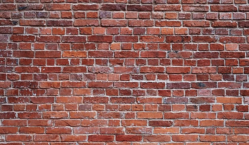 Old red brick wall close-up.