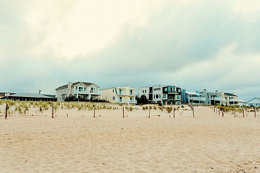 Sunset at Fenwick Island, Delaware Beach with homes along the sandy beach.