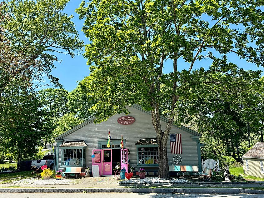  Old Lyme, Connecticut: Exterior of the Old Lyme Ice Cream Shoppe and Cafe, a local small-town business with unique decorations and outdoor seating on a spring day.