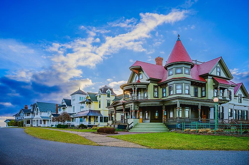 Sunrise over Oak Bluffs skyline, showcasing landmark houses and a dramatic winter cloudscape above Ocean Park on Martha's Vineyard, Massachusetts, United States.