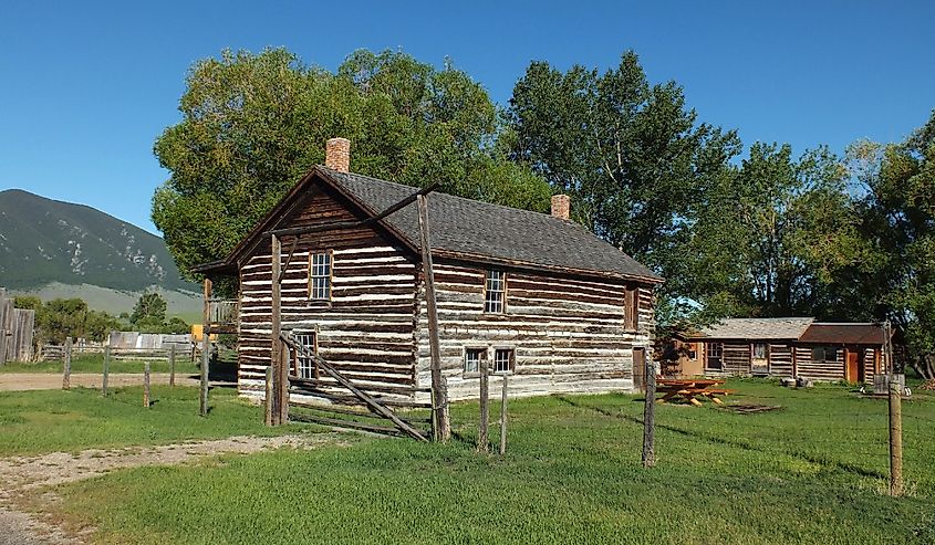 Historic Buildings with mountains in the background at Robber's Roost, Virginia City Montana