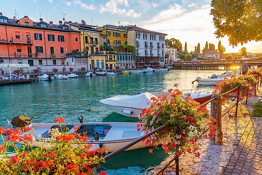 Sunset view of Canale di Mezzo in Italian town Peschiera del Garda. (Credit: Editorial credit: trabantos / Shutterstock.com)