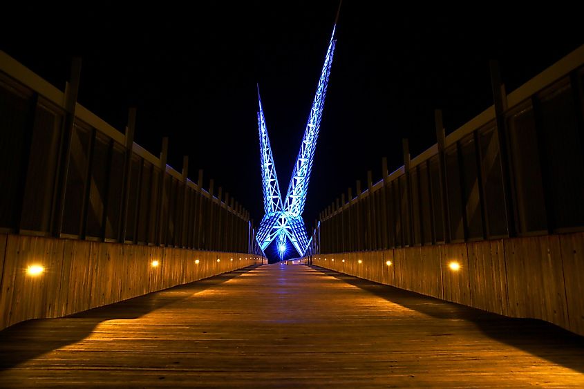 The Skydance Pedestrian Bridge illuminated at night in Oklahoma City, Oklahoma