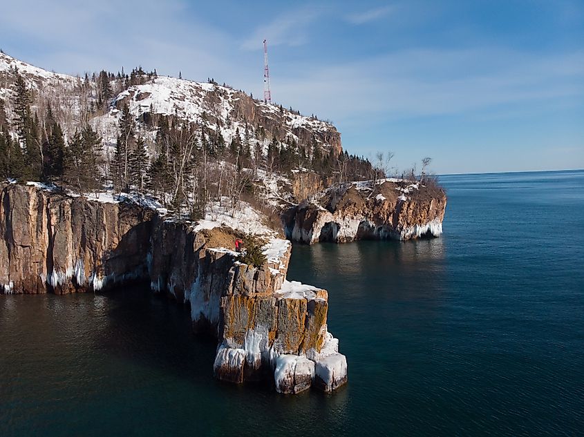 Winter snow cover the cliffs of Palisade Head in Minnesota.