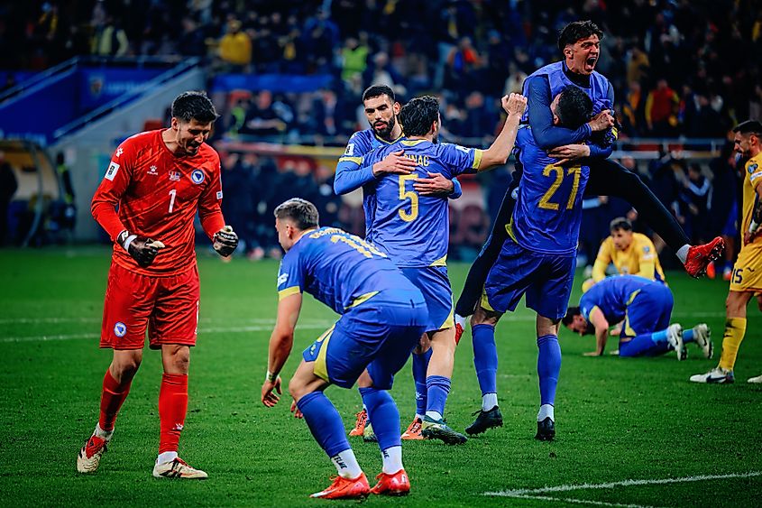 Bosnia and Herzegovina players celebrate at the end of the UEFA match. Editorial credit: Cristi Mitu / Shutterstock.com