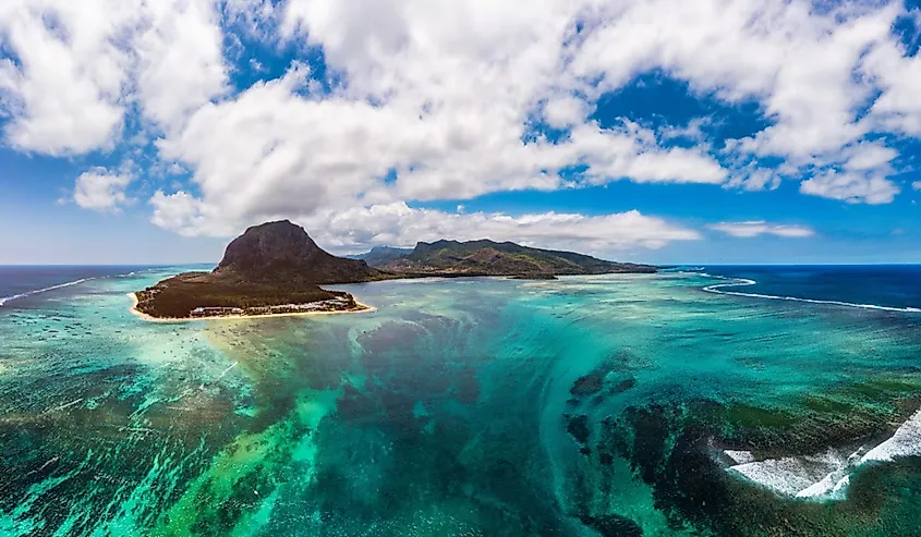 Aerial view of Mauritius island panorama and famous Le Morne Brabant mountain, beautiful blue lagoon and underwater waterfall.