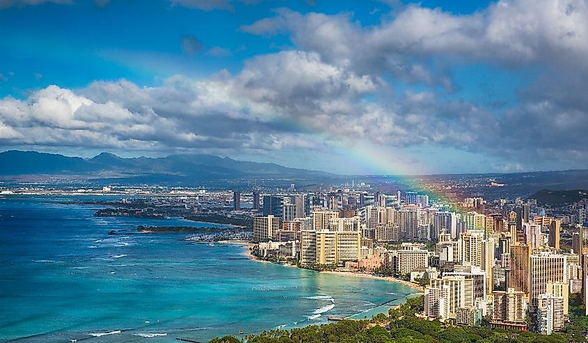 Rainbow over Honolulu skyline and city.