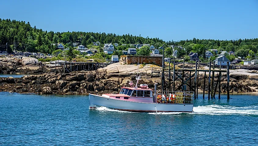 A lobster boat heading to sea in Stonington, Maine.