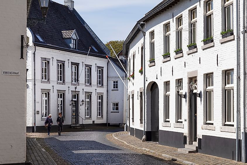 Tourists stroll the cobbled streets in the picturesque town of Thorn with its striking white painted houses.