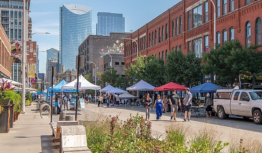 People enjoy a street fest in the Fulton Market District neighborhood in West Loop, downtown Chicago.