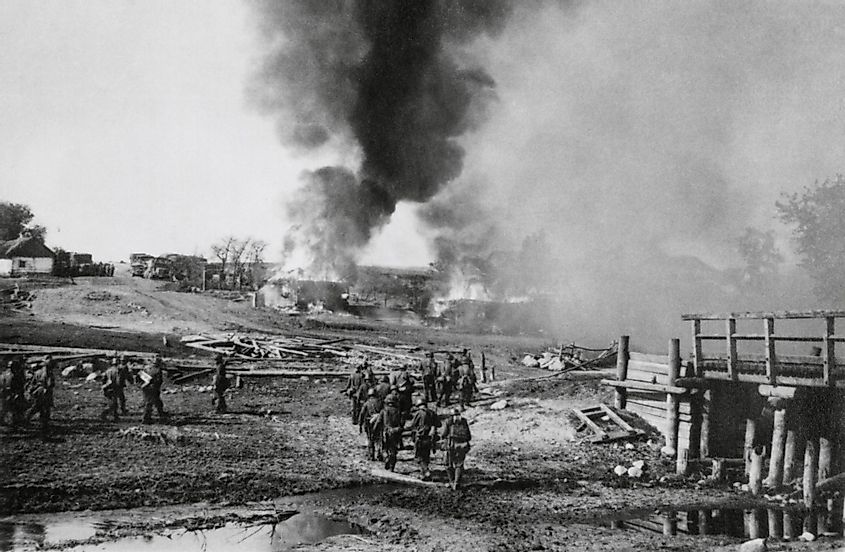 German infantry advancing on a burning village in the Soviet Union (Russia). 