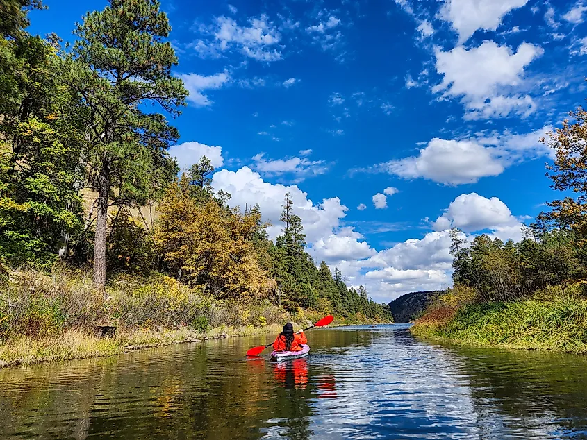 A kayaker kayaking at a lake in Payson, Arizona.
