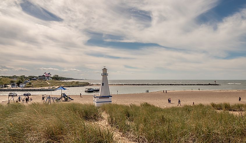 People explore the beach and harbor area in the town in summer, New Buffalo, Michigan