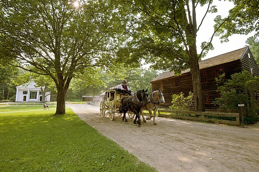 Horse carriage at Sturbridge Village, MA, offering a glimpse of 19th-century life, slow and peaceful. Editorial credit: GCC Photography / Shutterstock.com