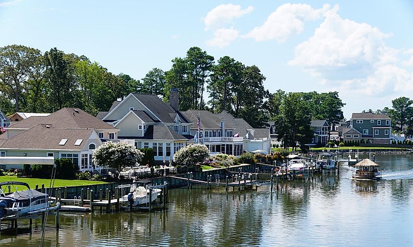 The luxury waterfront homes by the bay in the summer, via Khairil Azhar Junos / Shutterstock.com