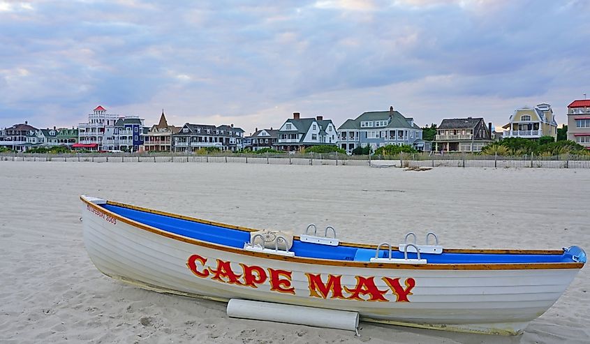 View of a boat with a Cape May sign on the beach in Cape May, New Jersey