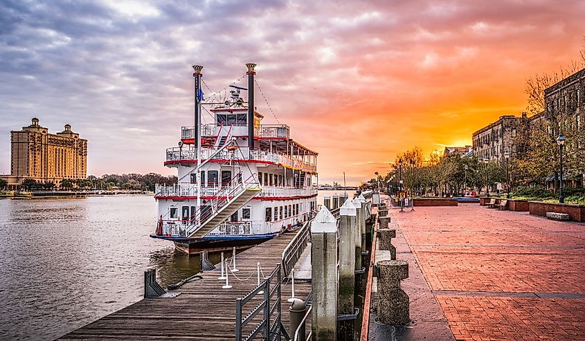 Savannah, Georgia, USA riverfront promenade at sunrise.