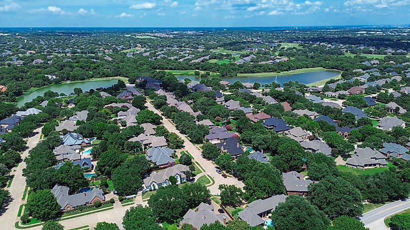 Dual scenic ponds with water fountain in upscale neighborhood in Colleyville, Texas.