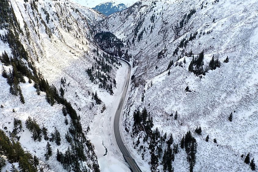 Aerial view of the Richardson Highway, Keystone Canyon, and Lowe River near Valdez, Alaska during the winter.