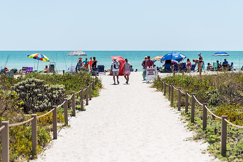 Bowman's beach with sandy trail path walkway by fence on Sanibel Island