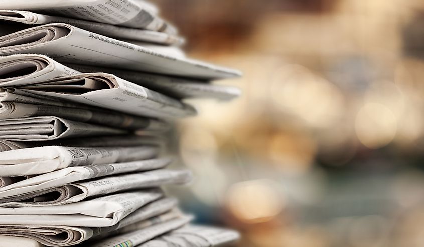 Pile of newspapers stacks on blur background