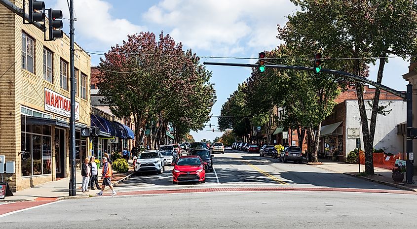Wide-angle view of Main Street, showing traffic and people on sidewalk in Brevard, North Carolina. 