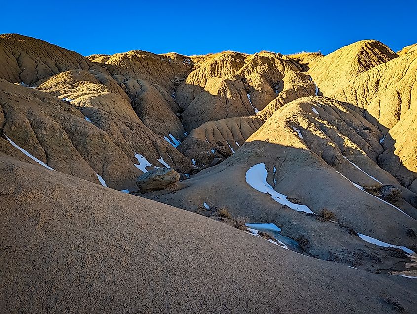 Snow deposits on the badlands of the Toadstool Geologic Park in Nebraska.