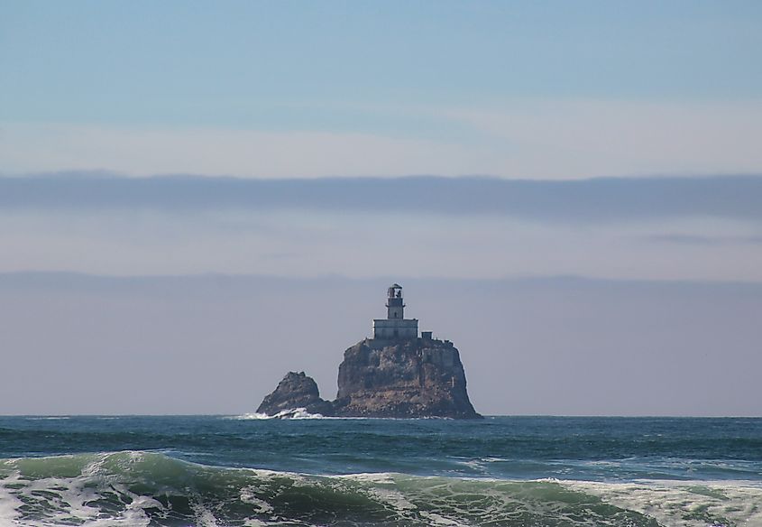 Green waves break in front of Tillamook Lighthouse, Oregon