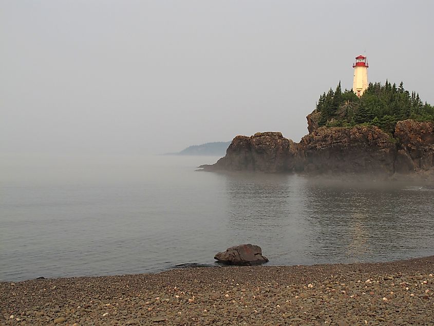 A photograph of Battle Island Light, a lighthouse in Ontario, Canada, on Lake Superior, taken in the mist