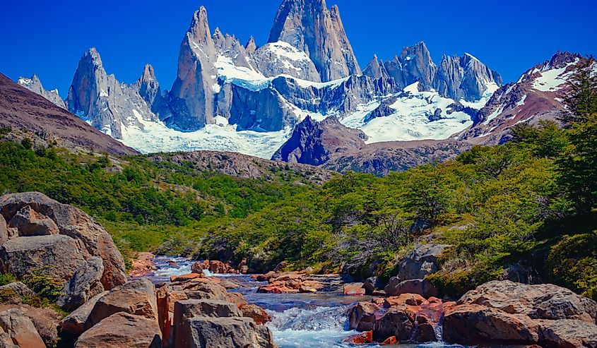 A blue river in El Chaltén, Patagonia, and Mount Fitz Roy in the background. Located at the Southern Patagonia Andes between Chile and Argentina.
