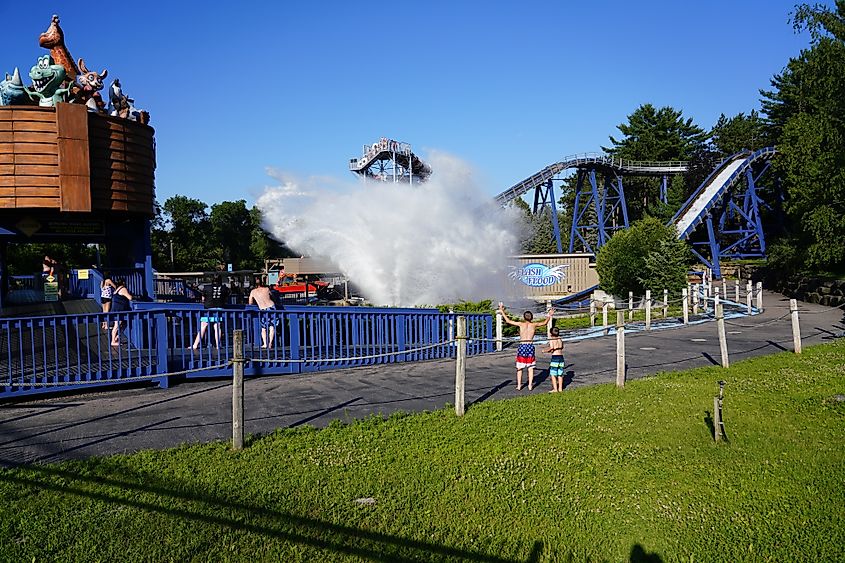 Editorial Photo Credit: Aaron of L.A. Photography via Shutterstock. Wisconsin Dells, Wisconsin USA August 11th, 2019: Family members enjoying summer fun at Noah's Ark water park flash flood water boat ride. 