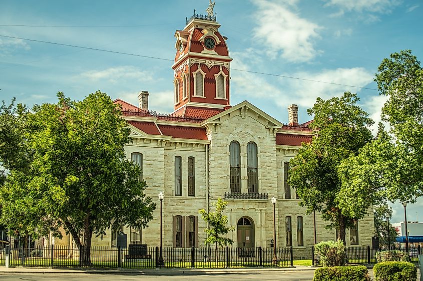 ounty Courthouse Building Surrounded By Trees in Lampasas, Texas
