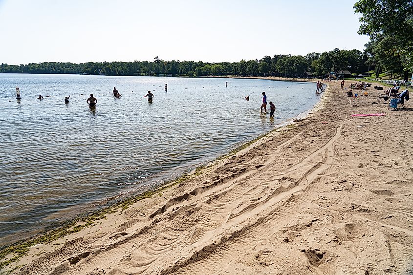 People having a great day by the lakeside beach in Brainerd, Minnesota.