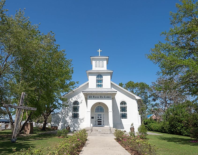 White stucco exterior of the St. Rose de Lima Roman Catholic Church in Bay St. Louis, Mississippi
