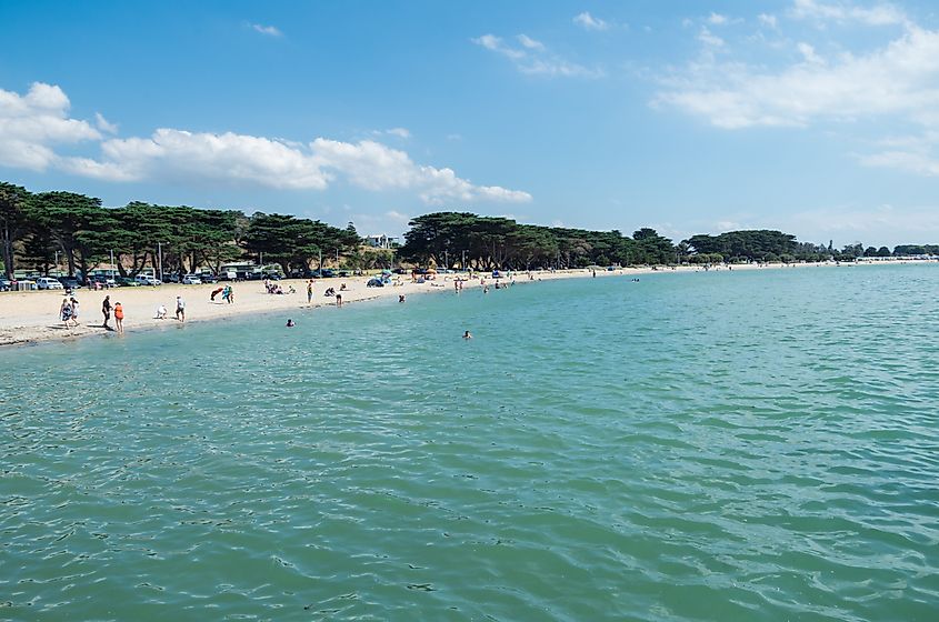 People along the beach in Portarlington, Australia.