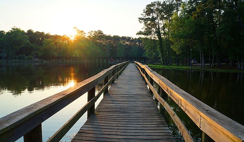 Walking path over a lake at sunset in Thomasville, Georgia