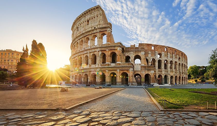 View of Colosseum in Rome and morning sun, Italy, Europe.