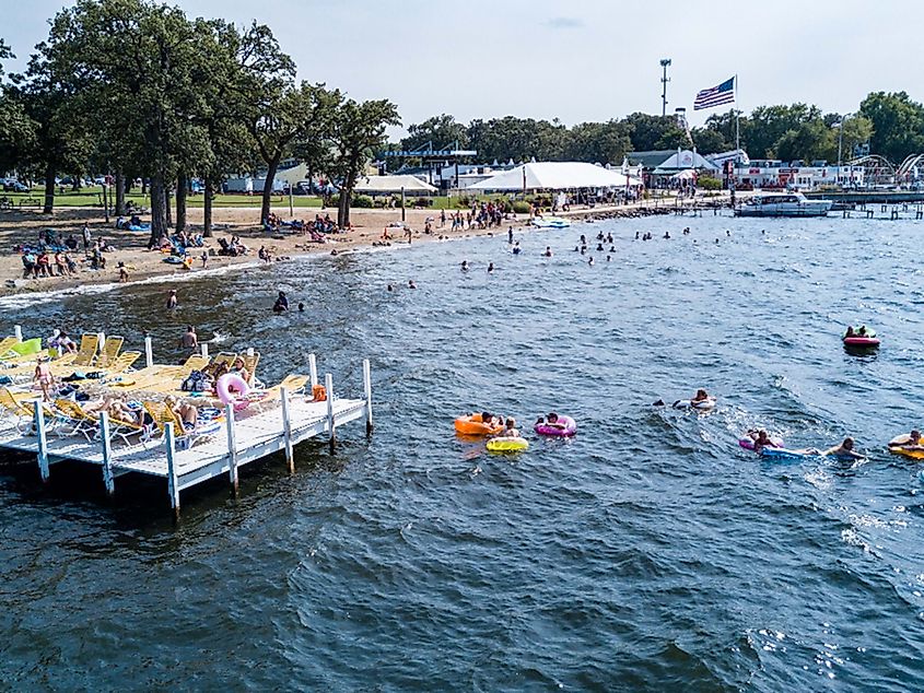 People swimming in Okoboji Lake, via 