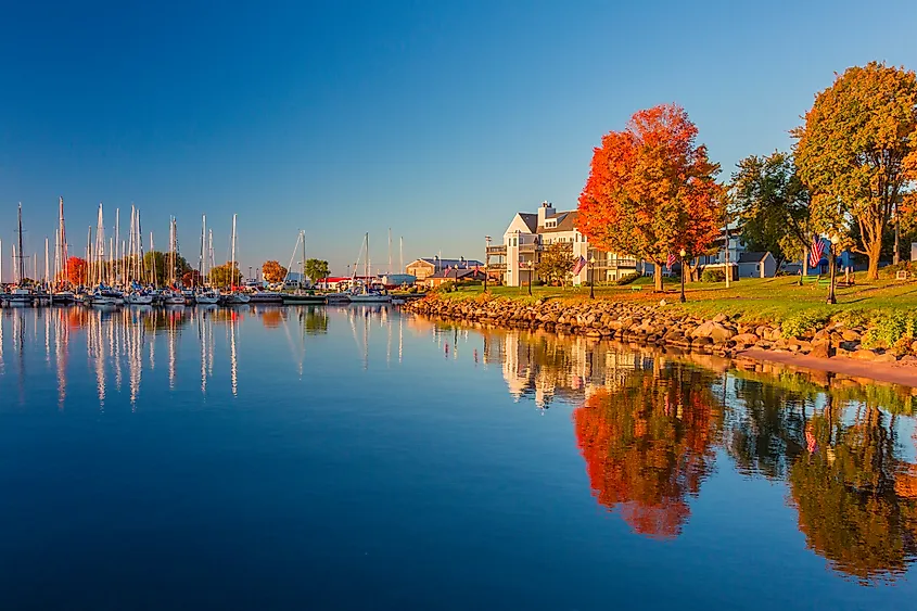 Fall colors reflected on the still waters of the harbor in Bayfield on Lake Superior