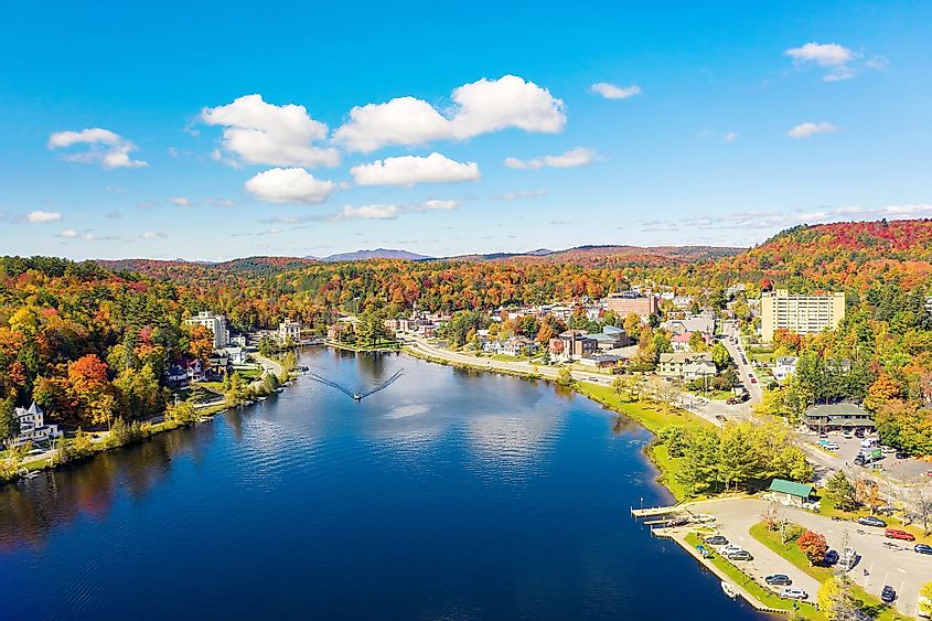 Colorful aerial view of Saranac Lake, New York in the Adirondack Mountains during fall