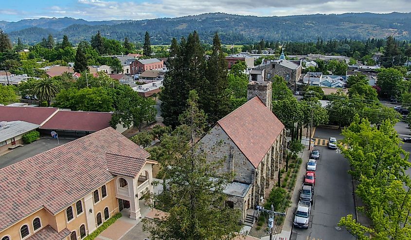 Aerial view of St. Helena Roman Catholic Church, historic church building in St. Helena, Napa Valley, California., USA. Built from 1889 to 1890, the church was constructed with stone